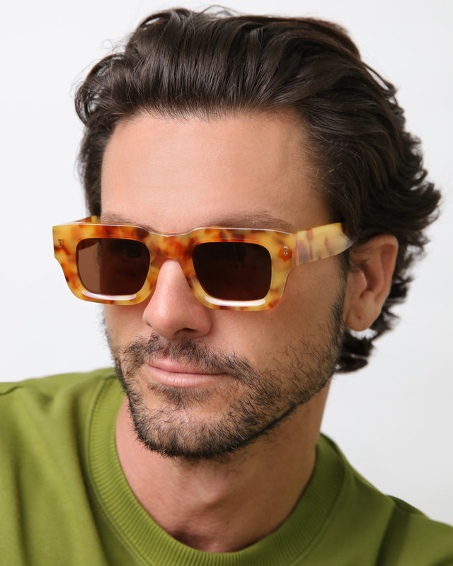 Model with brown hair combed back wearing Lewis Sunglasses Amber with Brown Flat
