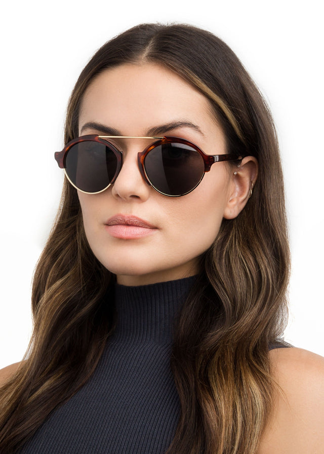 Brunette with wavy hair wearing Milan III Sunglasses Havana with Grey