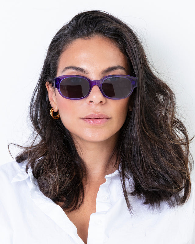 Brunette model with wavy hair wearing Montreal Sunglasses Violet with Grey Flat