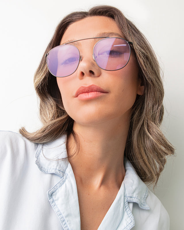 Brunette model with ombre hair wearing Mykonos II Sunglasses Gunmetal with Violet Flat See Through