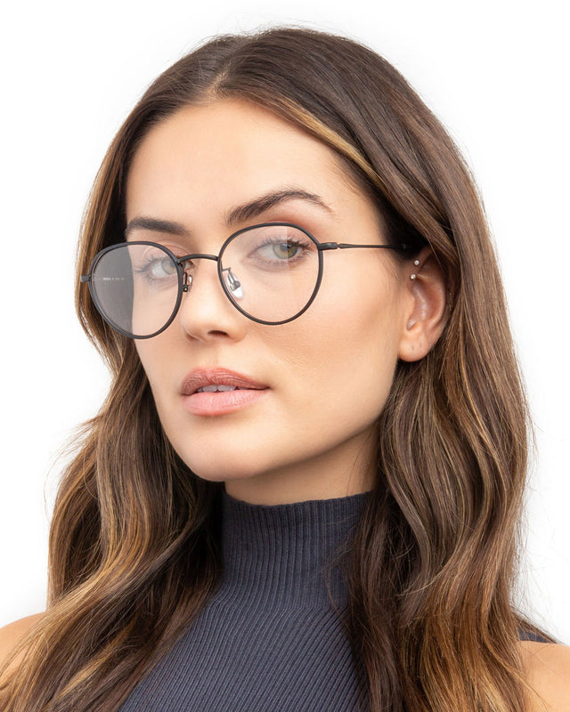 Brunette model with wavy hair  wearing Oxford 52 Optical Matte Black Optical