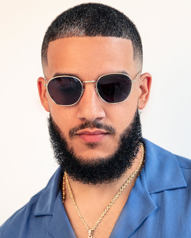 Bearded model with short fade wearing Prince Sunglasses Rose Gold with Grey Flat