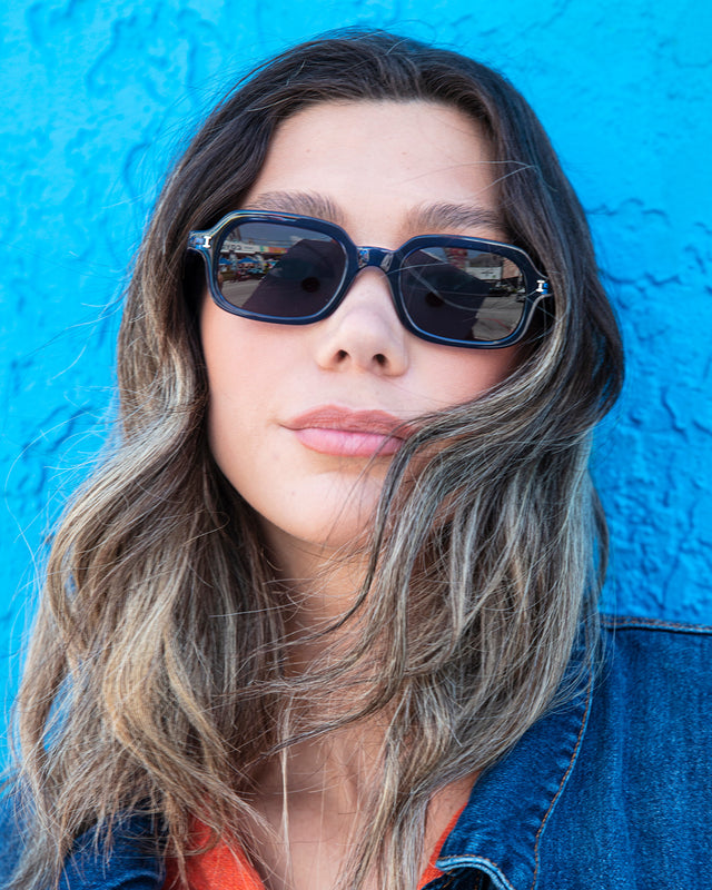 Brunette model with ombre wavy hair wearing Berlin Sunglasses Navy with Grey