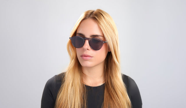 Blond woman in a black long tee wearing the almost sold out Capri in Mercury