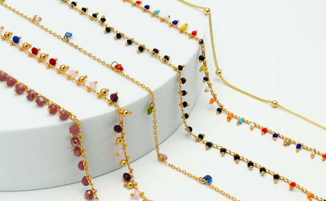 illesteva Sunglass Chains in new colors displayed on a round, marble slab