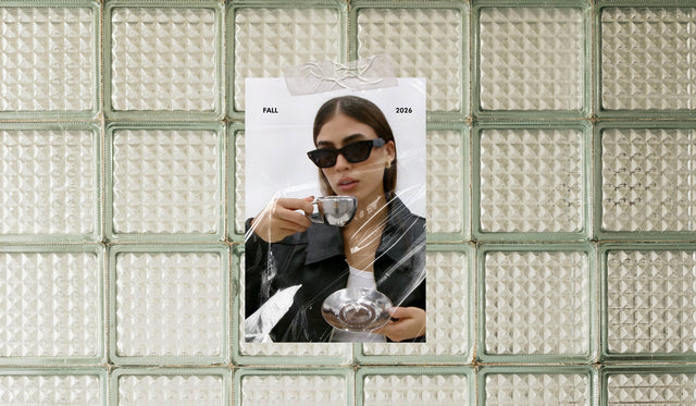 Polaroid of a woman wearing the Donna Sunglasses in black while holding a tea cup