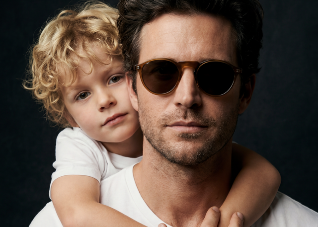 A man wearing the Capri Sunglasses with his son