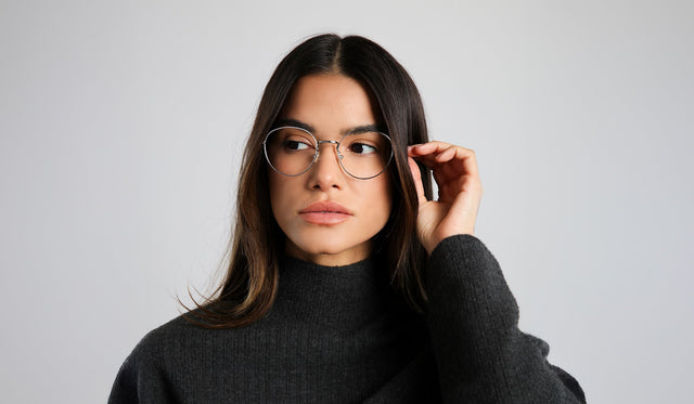 Woman in a dark cashmere sweatshirt wearing Jefferson Optical in Silver