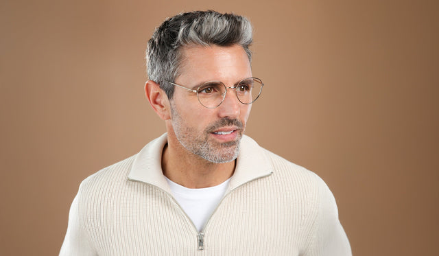 Man in a knit half zip sweatshirt wearing Jefferson Optical in Rose Gold