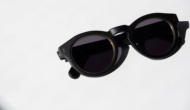 The Leonard Ring Sunglasses on a white counter
