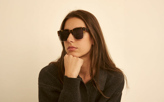 Woman in a cashmere blouse wearing the Los Feliz Sunglasses in Half Half Tortoise Champagne