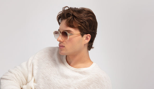 Man in a waffled shirt wearing the Memphis Sunglasses in Champagne