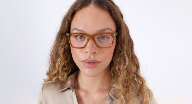 Brunette model with ombre hair wearing Veneto Optical