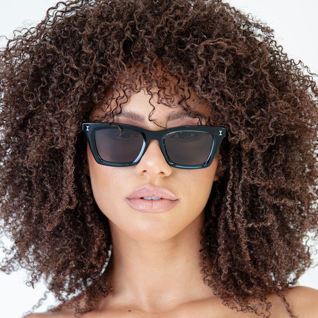 Women Fit Model wearing Portugal Sunglasses in Black
