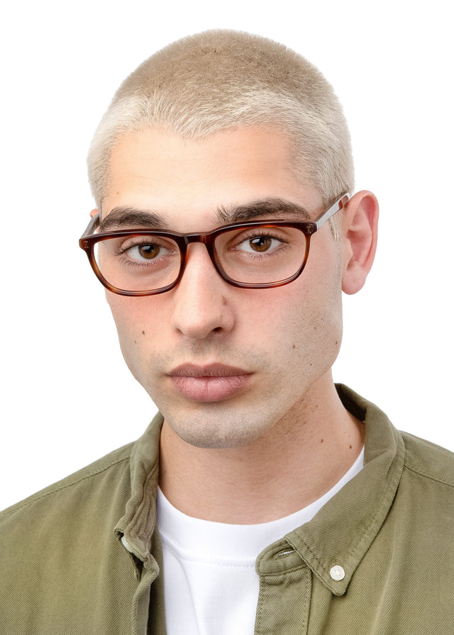 Man with blonde buzzcut wearing Albany Optical Havana Optical
