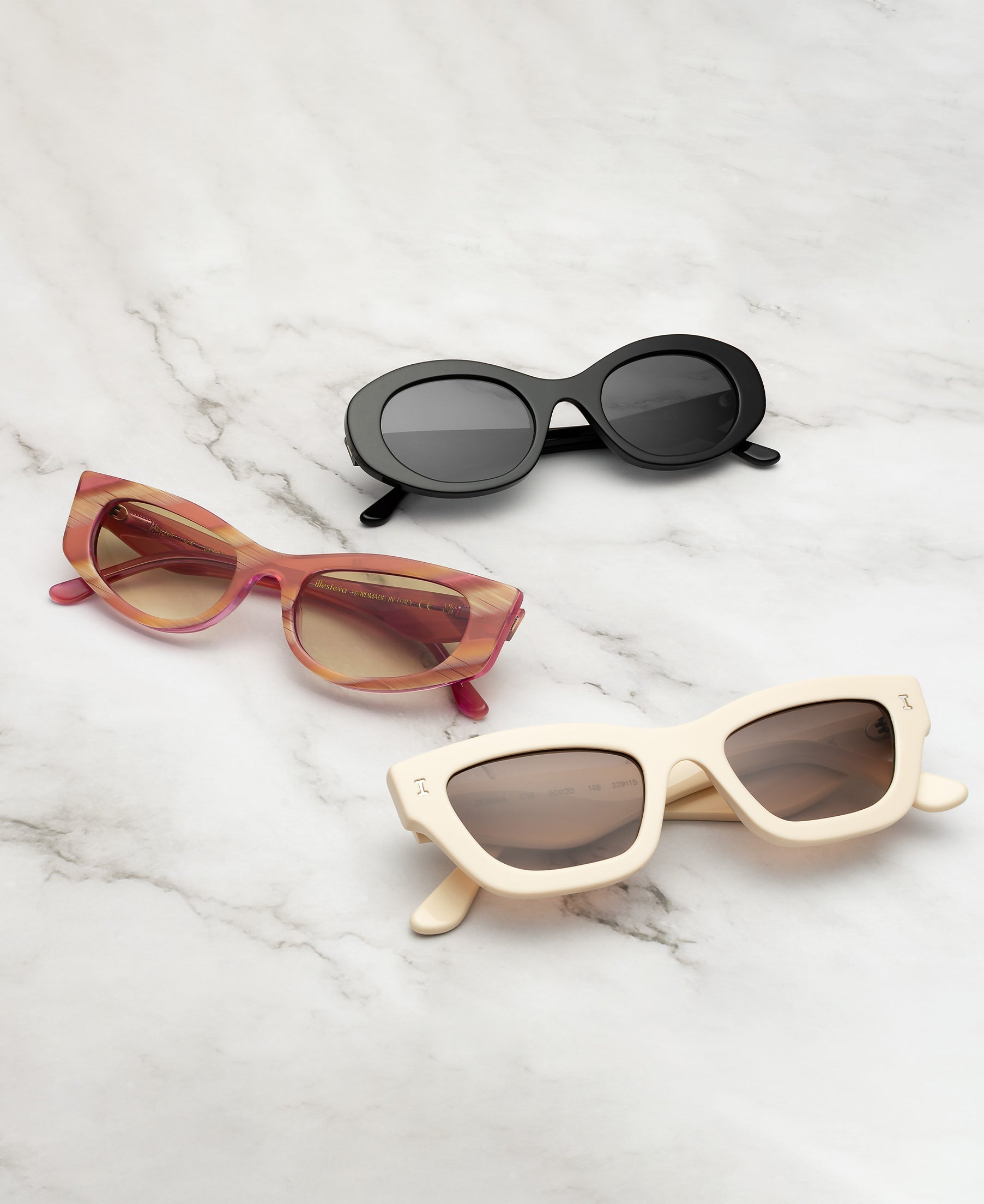 Luna Sunglasses in Black, Alexa Sunglasses in Monte Rosa, and Donna in Cream displayed on a marble background