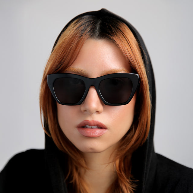 Red-haired model wearing Bali Sunglasses Black with Grey