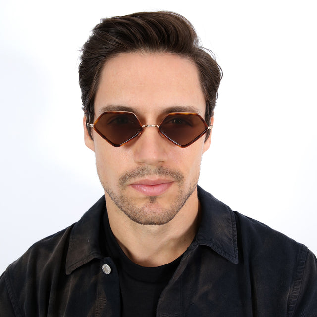 Model with short brown hair combed sideways wearing Beak Ace 53 Sunglasses Havana/Gold with Brown Flat