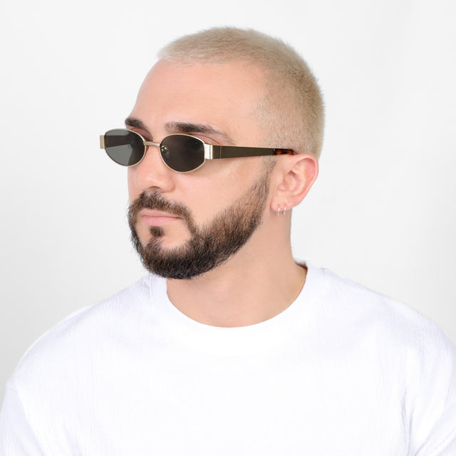 Bearded model in a white shirt wearing Bellagio Sunglasses Brushed Gold with Grey