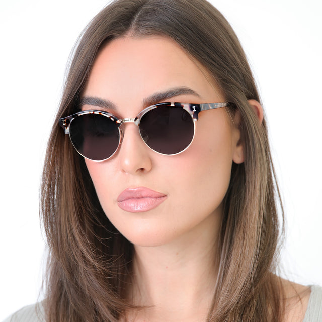 Brunette model with straight hair wearing Benson Sunglasses White Tortoise Gold with Grey