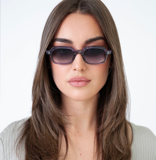 Brunette model with straight hair wearing Berlin Sunglasses Purple Aurora with Grey Gradient