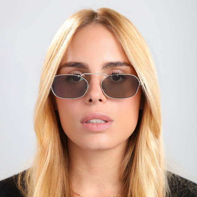 Blond woman in a black tee wearing Bimini Sunglasses Silver/Tortoise with Olive Flat