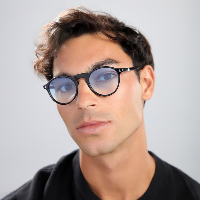 Man with brown hair wearing Capri Sunglasses Black with Blue Gradient See Through