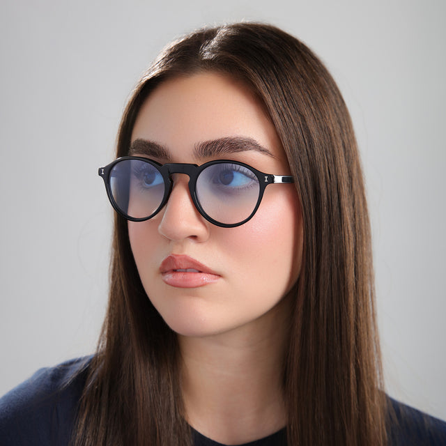 Another angle of brunette model wearing Capri Sunglasses Black with Blue Gradient See Through