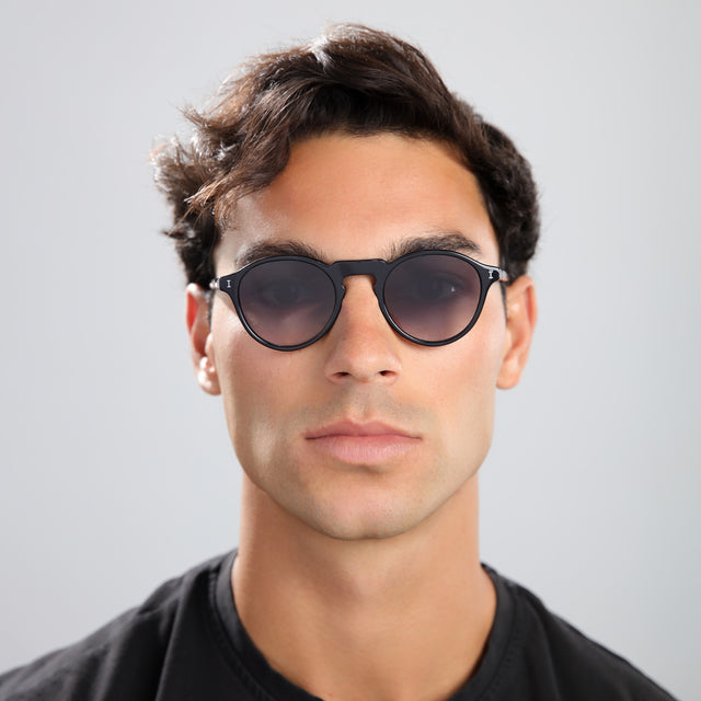 Man in black tee wearing Capri Sunglasses Black with Grey Gradient