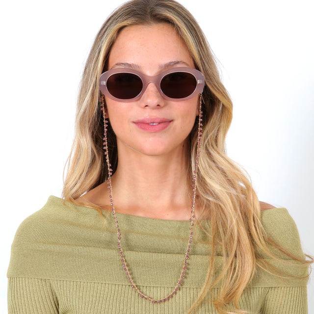 Blonde model with loose curls wearing Sunglass Chain Casablanca