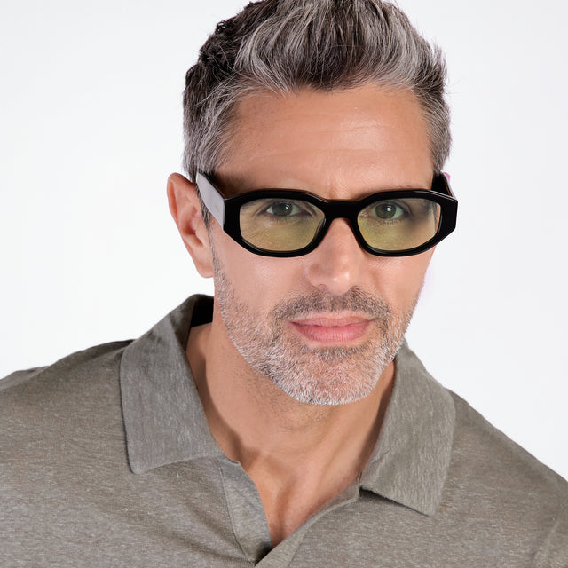 Model with salt and pepper hair and beard wearing Cassette Sunglasses Black with Mint Flat See Through