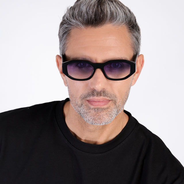 Model with salt and pepper hair and beard wearing Cassette Sunglasses Black with Purple Flat Gradient