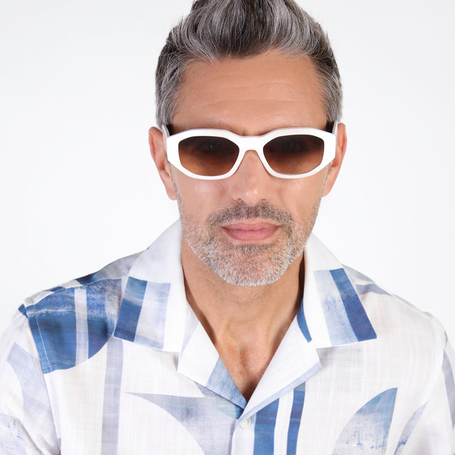 Model with salt and pepper hair and beard wearing Cassette Sunglasses White with Brown Flat Gradient