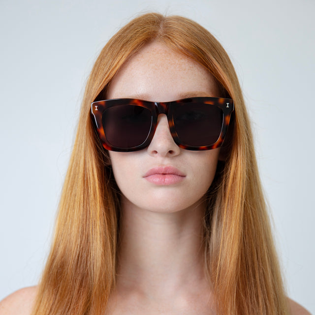 Model with straight red hair wearing Charleston Sunglasses Havana with Grey Flat