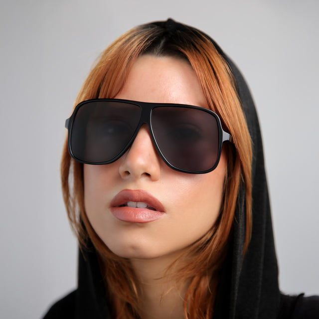 Another angle of model with red hair wearing Connecticut Sunglasses Black with Grey