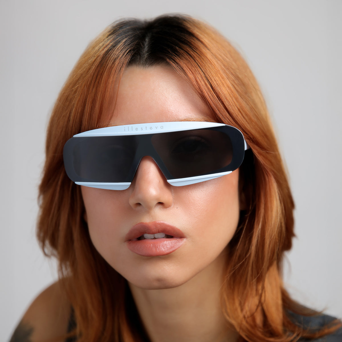 Woman wearing Courchevel Sunglasses in Matte Baby Blue with Grey lenses, Another angle of red-haired model