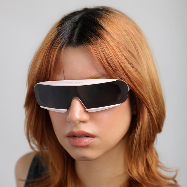 Red-haired model wearing Courchevel Sunglasses Matte Blush with Grey