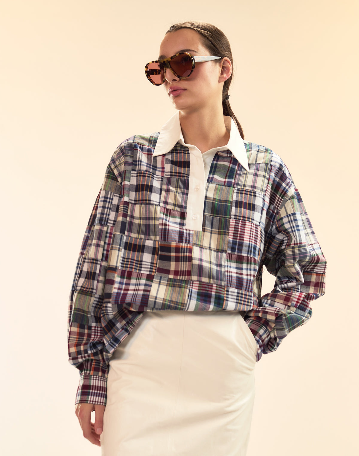 Cynthia Rowley x illesteva featured on a woman in a quilted blouse and skirt