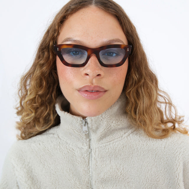 Brunette with an ombre wearing Donna Sunglasses Havana with Blue Gradient See Through