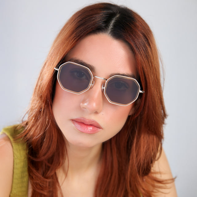 Woman with red hair in a chartreuse blouse tilting her head Dylan Tate Sunglasses side view in Citrine/Gold / Grey Flat