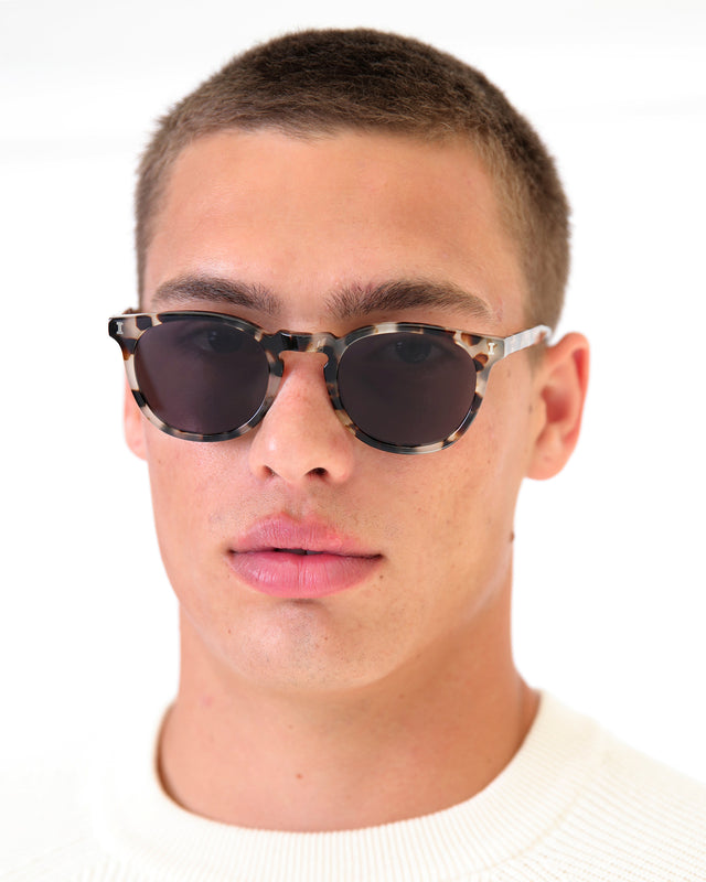 Model with buzzcut wearing Eldridge 48 Sunglasses White Tortoise with Grey Flat Lenses