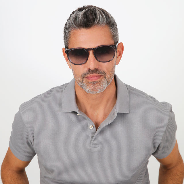Model with salt and pepper hair and beard wearing Eldridge 56 Sunglasses Onyx with Grey Flat Gradient