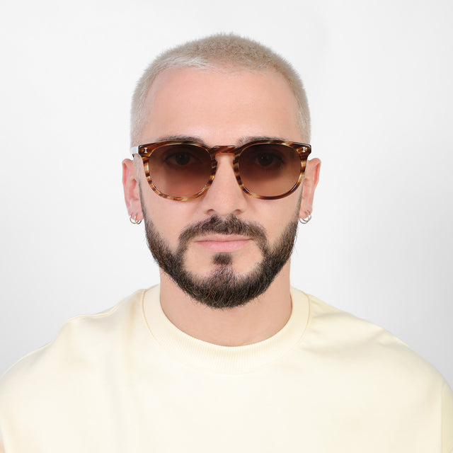 Model with platinum buzzcut wearing Eldridge 56 Sunglasses Sand Dune with Brown Flat Gradient