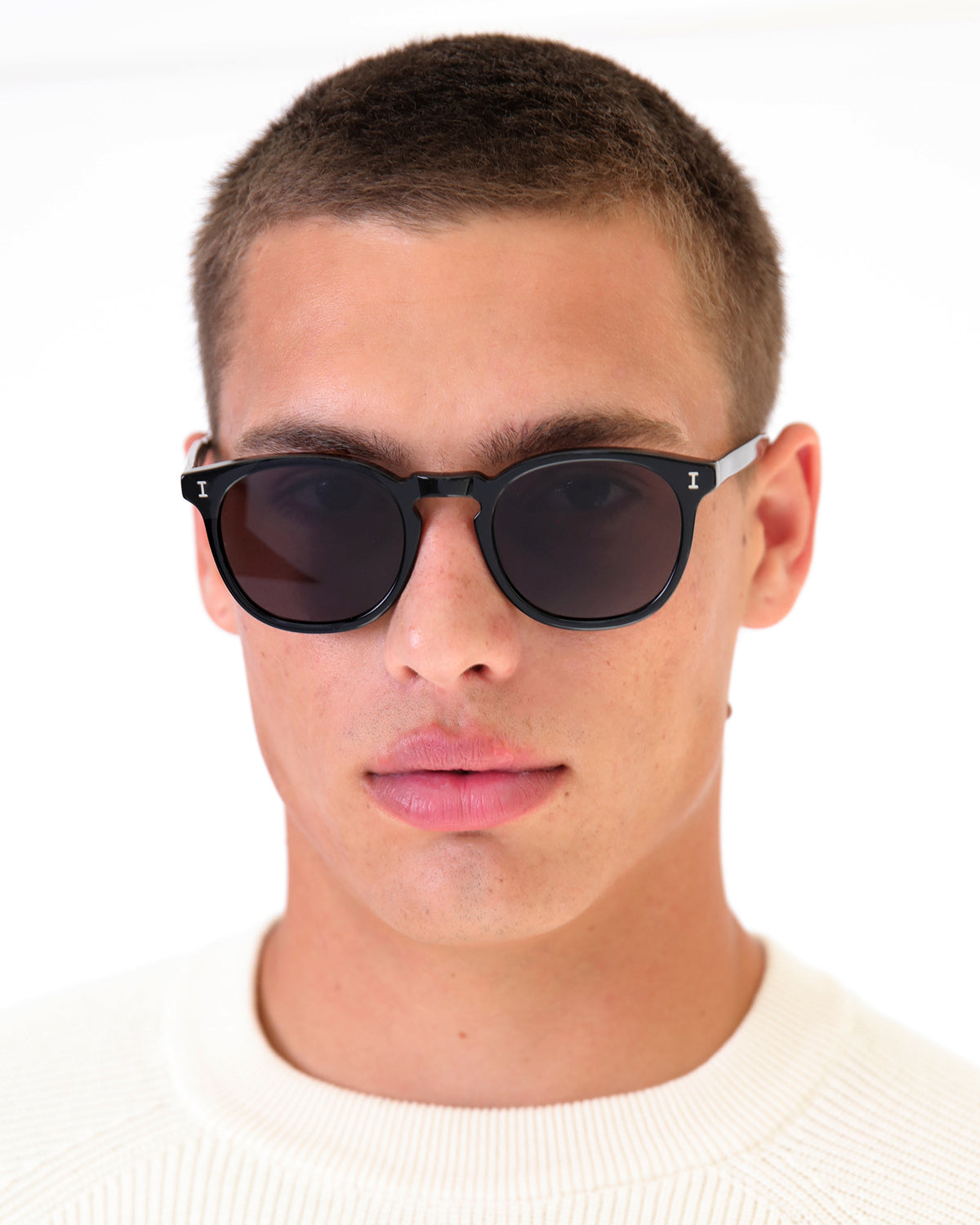 Man wearing Eldridge Sunglasses in Black with Grey Flat lenses, Model with buzzcut