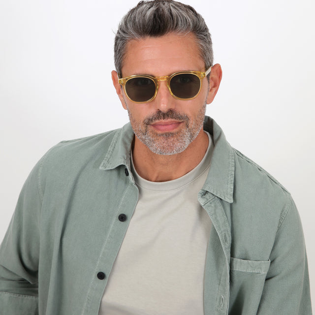 Model with salt and pepper hair and beard wearing Eldridge Sunglasses Clear Blond with Olive Flat