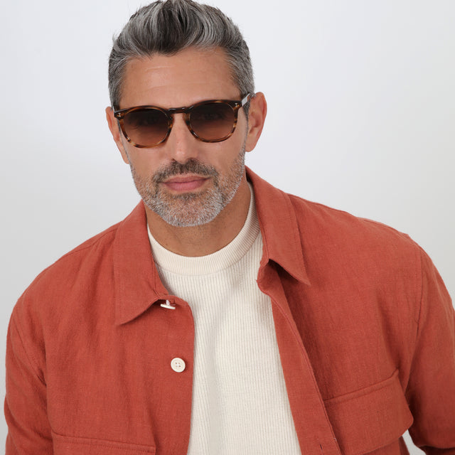 Model with salt and pepper hair and beard wearing Eldridge Sunglasses Sand Dune with Brown Flat Gradient