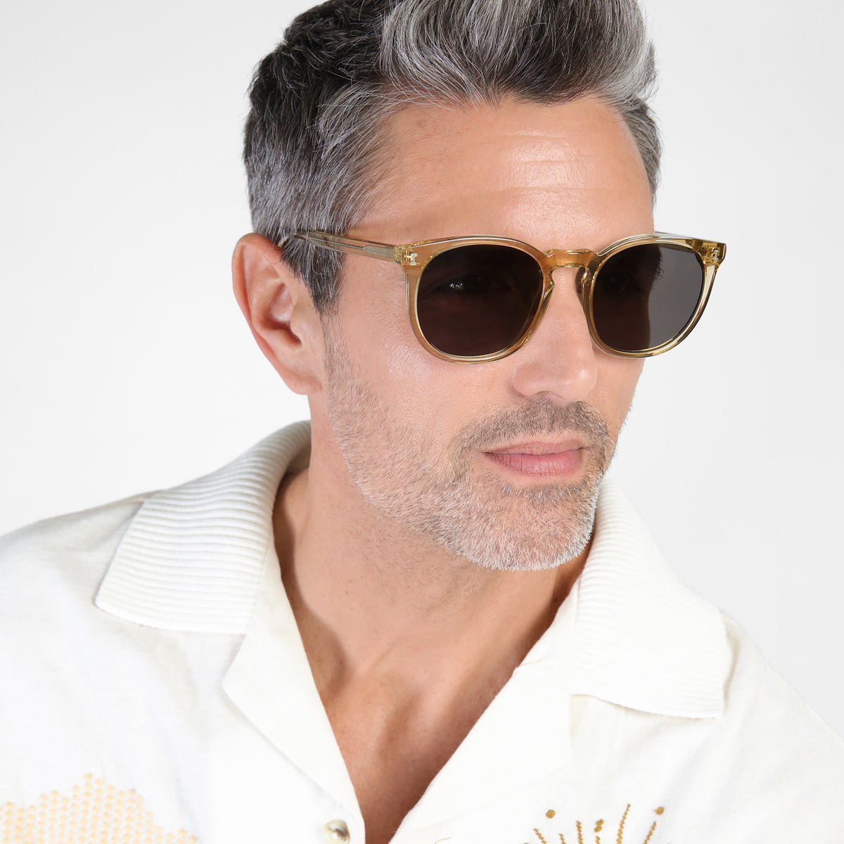 Man wearing Eldridge 56 Sunglasses in Citrine with Grey Flat lenses, Model with salt and pepper hair and beard looking left
