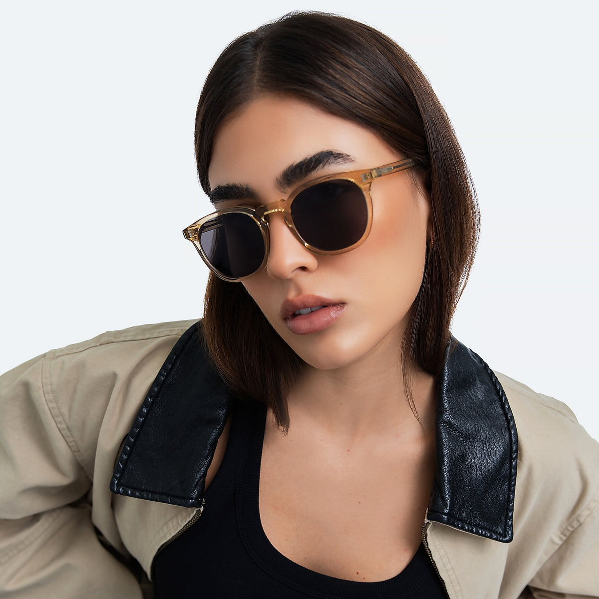 Woman wearing Eldridge 56 Sunglasses in Citrine with Grey Flat lenses, side profile, Another angle of woman in a trench coat