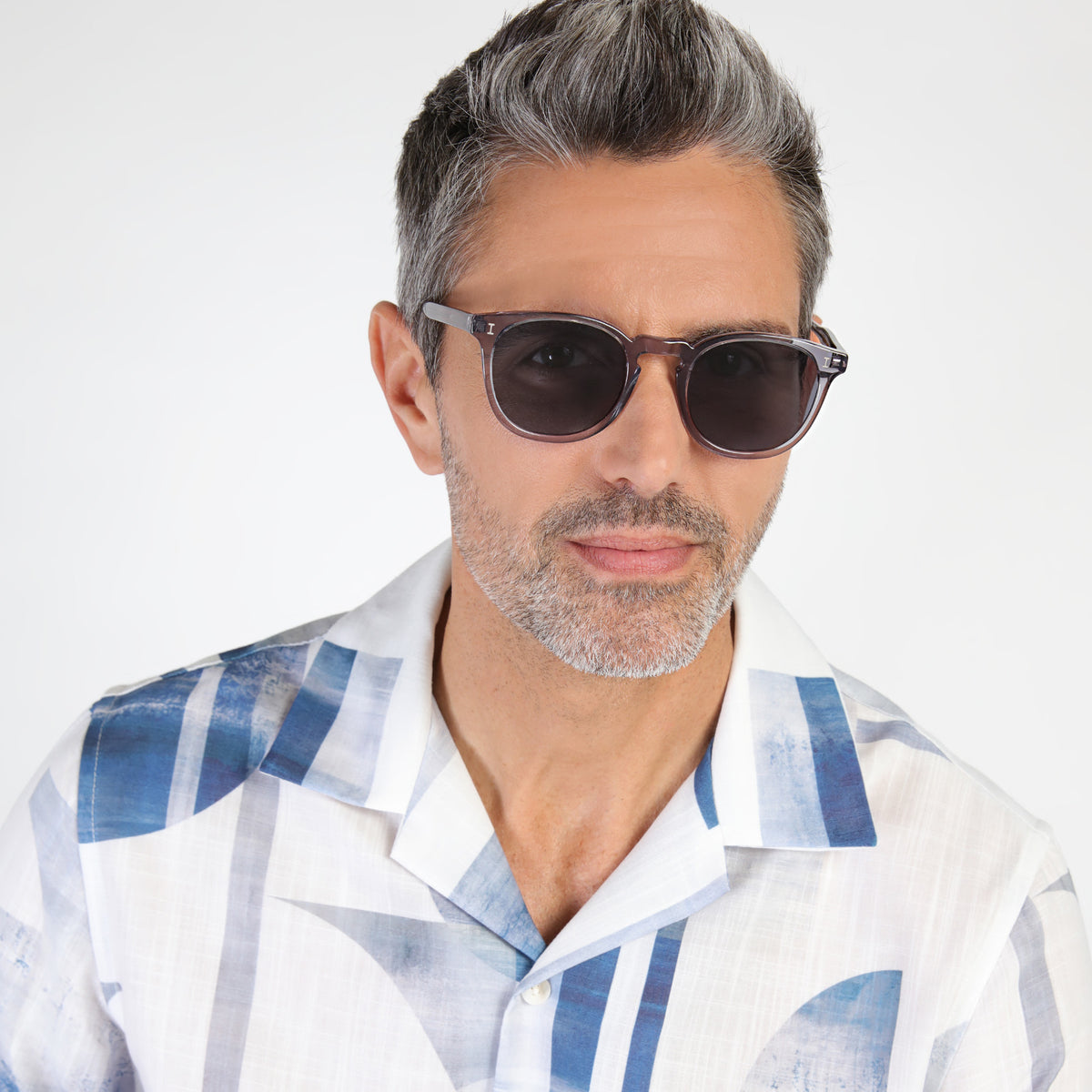 Man wearing Eldridge Sunglasses in Mercury with Grey Flat lenses, Model with salt and pepper hair and beard
