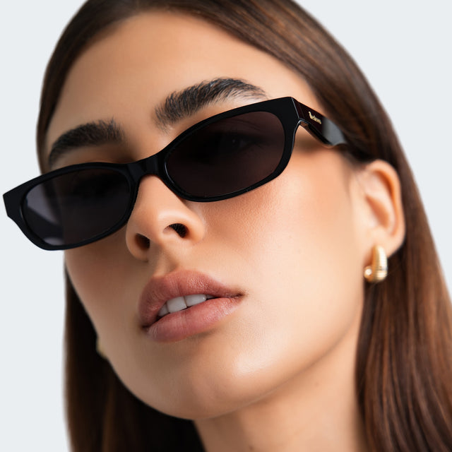 Close up of a woman wearing Encinitas Sunglasses Black with Grey